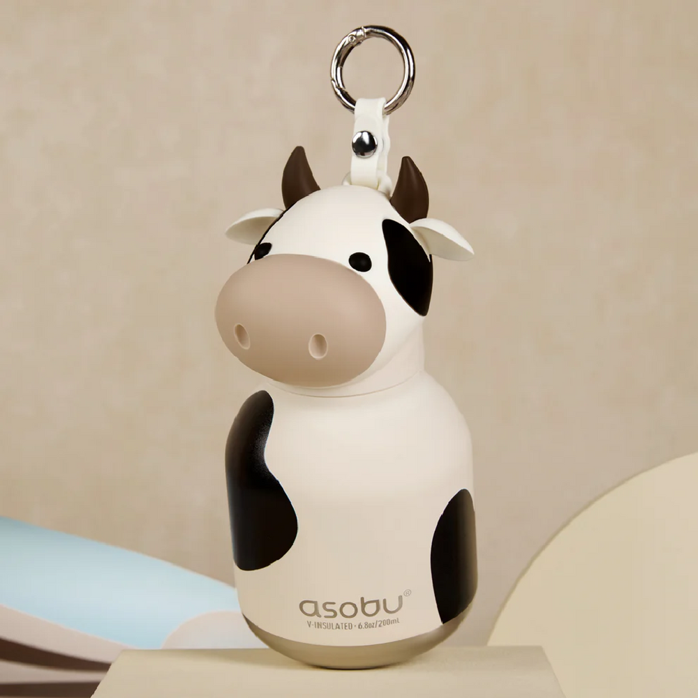 Cow-shaped bottle with 'asobu' branding on a beige background